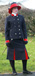 J 1 double breasted straight front jacket Red velvet trim piped in silver Shown with matching skirt.jpg